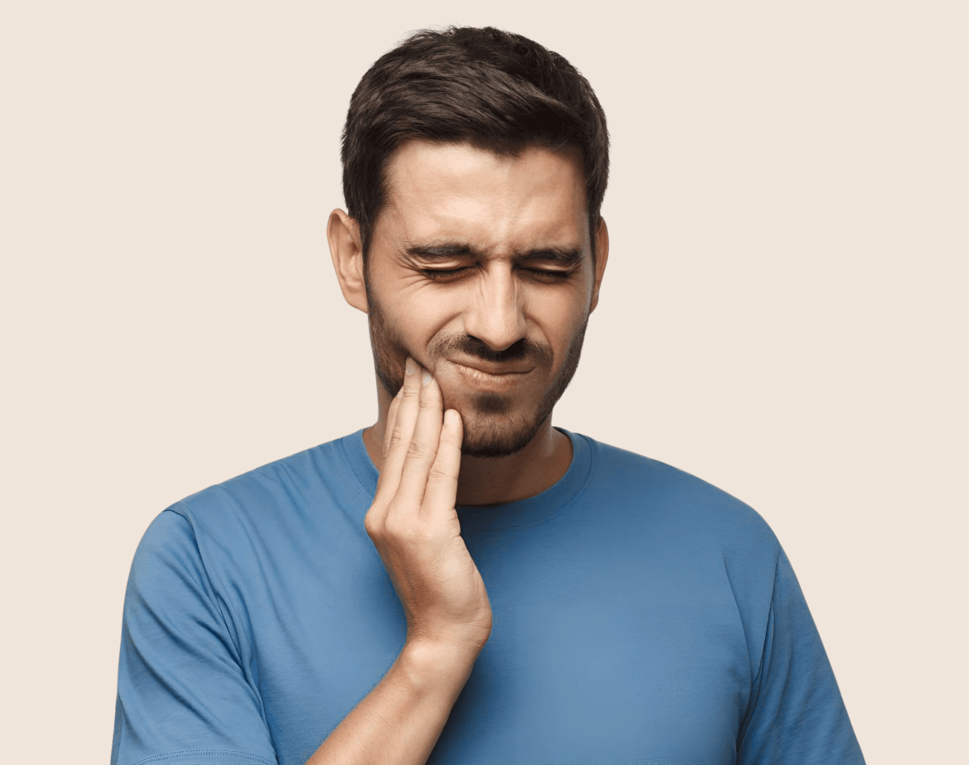 Person holding his cheek in pain from a toothache